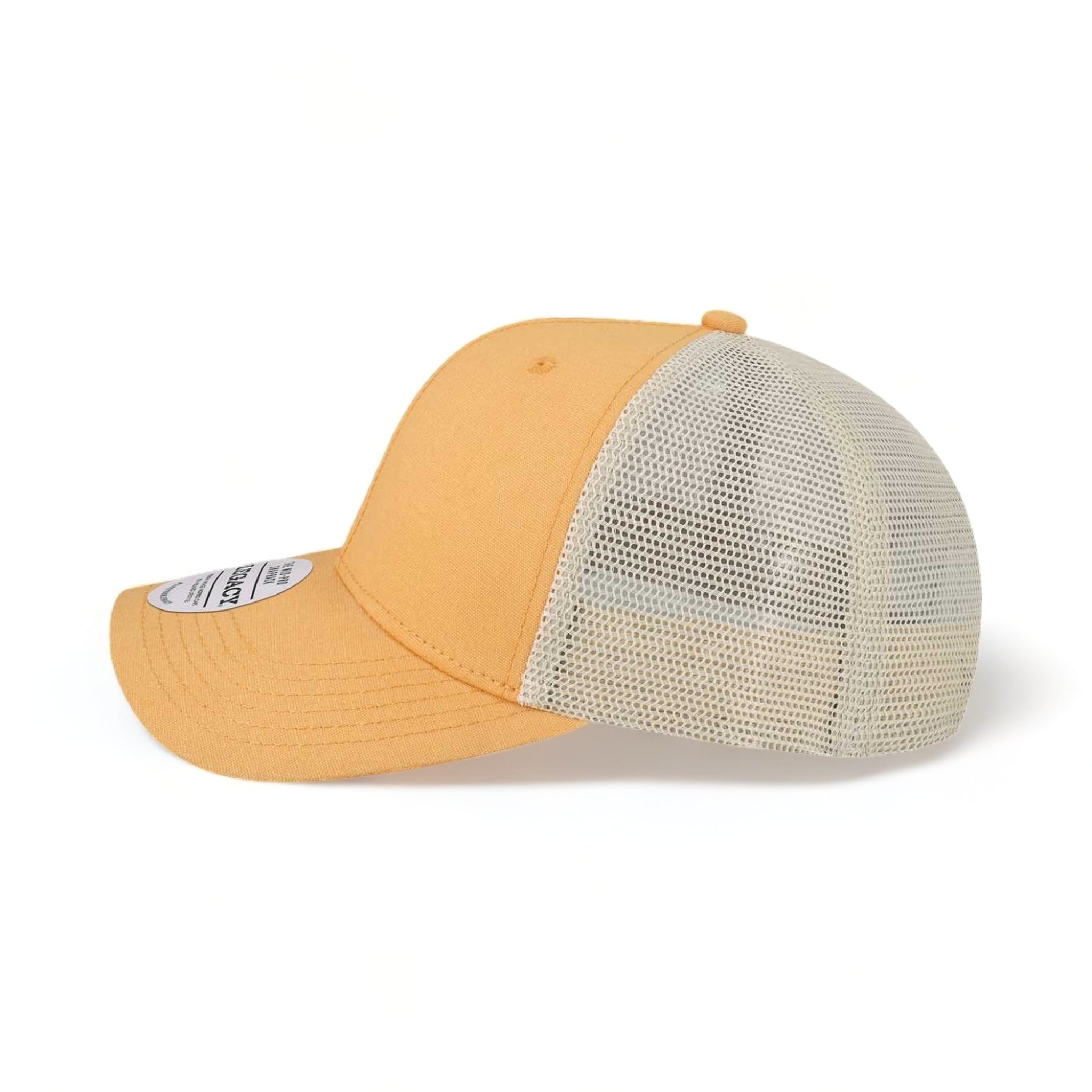 Side view of LEGACY MPS custom hat in peach and stone